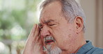 Stress, headache and senior man in living room with sickness, exhaustion or burnout at home. Tired, migraine and elderly person in retirement with medical emergency for illness in lounge at house.