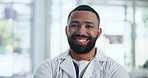 Hospital, doctor and face of black man with crossed arms for medical career, service and consulting in clinic. Professional, healthcare and portrait of worker confident for wellness, trust and care