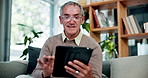 Smile, tablet and senior man on sofa with connection, subscription or online news website in home. Scroll, internet and person on couch with communication, retirement and digital app in living room