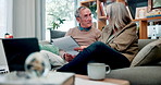 Paperwork, laptop and senior couple on sofa with home budget, pension plan or insurance application. Research, man and woman on couch with retirement documents, contract or discussion in living room