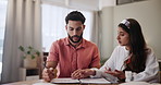 House, table and couple with documents in discussion for debt, financial investment and planning together. Man, woman and communication with paperwork at home for mortgage, budget and review of bills