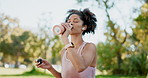 Fitness, park and woman with water bottle, nature and exercise with summer, thirsty and training. Athlete, person or healthy girl with hydration, workout and wellness with sports, outdoor and summer