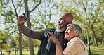 Love, selfie and senior couple hug in a park with photography, trust and bonding in nature. Interracial marriage, care and elderly people in forest for profile picture, fun and retirement trip memory