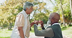 Love, proposal and senior couple in park with celebration, future and security in nature together. Engagement, question or old man with ring for excited woman in forest with surprise romantic gesture
