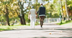 Park, walking and old couple holding hands, love and sunshine with peace, romance and marriage. Blur, outdoor and man with woman, summer and relationship with vacation, hobby and anniversary with joy