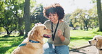 Volunteer, woman and dogs outdoor with smile of support staff with community service in a park. Volunteering, animal shelter and fun with helping for charity and nature with pet and NGO at garden