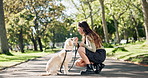 Woman, dog or pet for feeding outdoor in road with treats, snack and comfort for reward and walking in park. Animal, puppy and eating in street for nutrition, bonding and playful in nature with leash