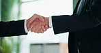 Businessman, handshake and meeting with partnership for deal, b2b or agreement together at office. Closeup of man, colleagues or employees shaking hands for teamwork, hiring or welcome at workplace