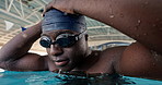 African man, cap and goggles in swimming pool for speed, cardio and ready for global competition. Person, swimmer and thinking with vision for exercise, sports and prepare for international contest