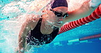 Swimming, athlete and woman in water with cap for performance training, competition or challenge. Sports, pool and swimmer with goggles for fitness, race contest or endurance exercise underwater