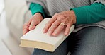 Closeup, hands and senior woman with a bible, faith and trust with religion, peace and wellness. Zoom, female person or elderly lady with scripture, holy book and worship with gratitude and guidance