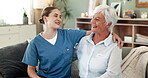 Nurse, hug and elderly woman on sofa in retirement home, nursing care and happy for wellness service. Embrace, relax and living room together or conversation, medical volunteer and caregiver employee