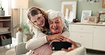 Senior mother, woman and selfie in home with smile, hug and photography on sofa in living room. Elderly mom, daughter and happy on lounge couch for profile picture, memory or embrace in family house