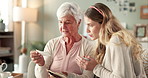 Grandma, woman or photograph for memory in house for nostalgia, learning or to remember. Senior grandmother, girl or family with pictures of old people, history or retro album on sofa in home lounge