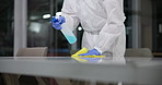 Spray, disinfectant and person in ppe in lab for germs, virus exposure or prevent infection. Protection, cleaning and health worker with disposable suit for decontamination, chemical or medical waste