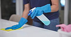 Hands, wipe and spray for cleaning counter in home, disinfection and maid for housekeeping. Woman, maintenance service and chemical treatment to prevent germs, bacteria and disease for health safety