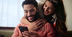 Happy couple, hug and laughing with phone for funny joke, meme or bonding in living room at home. Man and woman in relax with smile on mobile smartphone for social media, embrace or love on sofa