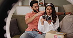 Couple, people and gift in home with ring light for social media, campaign and influencer with camera. Happy, content creator and record or live stream with vlog, paid partnership or review for brand