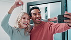 Couple, keys and selfie for new home with moving success, mortgage and purchase of real estate property together. Excited people or young man and woman live streaming and vlogging with lock for house