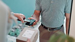 Delivery, customer hands and box with phone for POS, payment and transaction at home in courier services. E commerce with people exchange for package and easy or fast distribution on mobile app order