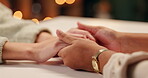 Restaurant, table and couple holding hands with love on anniversary, date and marriage with care. People, travel and trust in support of partnership with loyalty to commitment or time for bonding