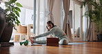 Woman, pilates and stretching with tablet in tutorial, online class or fitness lesson on mat at home. Young female person or yoga in warm up on technology for exercise tips, training steps or workout