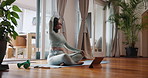 Woman, yoga and stretching with tablet for online class, tutorial or fitness lesson on mat at home. Young female person or yogi in warm up with technology for exercise tips, training steps or workout
