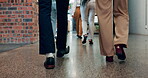 Walking, office and business people with shoes, feet and team at journalist company. Back, floor and staff ready for a meeting with group at a workplace together in a hallway and workplace corridor