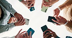 Business people, hands and networking with phone below for communication, data share or sync on a white background. Low angle or closeup of young employees on mobile smartphone, social media or app