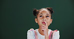 Girl, thinking and child with question in studio, dark background and learning info in education mockup. Remember, knowledge and kid brainstorming creative dream in school and problem solving