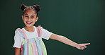 Happy, face and girl kid with hand pointing in studio for news, announcement or checklist steps on green background. Choice, menu or portrait of child model with finger direction, timeline or guide