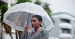 Indian woman, rain and walking with umbrella for travel, business trip or commute to work in winter season. Female person or employee strolling in neighborhood with protection  from rainy day in town