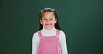 Happy, kid and face of girl in studio on green background with excited energy or back to school. Education, portrait and child at academy for learning or growth of gen z student with style or fashion