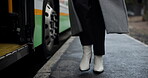 Walking, feet and outdoor in station, bus and person in morning, winter and routine to travel for work. Closeup, legs and foot of employee, ride and commute with vehicle for public and New York