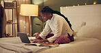 Education, laptop and night with black woman in bedroom at home for distance learning or remote study. Computer, notebook and research with college or university person on bed of apartment in evening