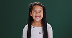 Happy, girl and face of child in studio on green background, mockup and back to school. Education, portrait and kid excited at academy for learning or growth of gen z student with style or fashion