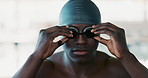Face, swimmer and black man with goggles, swimming cap or prepare for morning workout. Sports, portrait and hands of athlete person for performance training, water competition or confidence in race