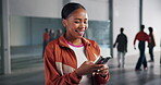 Smile, black woman and mobile on campus for social media, meme or scroll internet. Connectivity, dance student and gen z girl with smartphone in studio for chat online, happiness or networking app