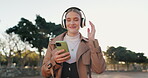 Businesswoman, headphones and cellphone or park walking for work commute, streaming or podcast. Female person, dance and happiness in urban city for morning travel with music, entertainment or audio