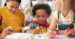 Happy children, drawing and paper with class in kindergarten for fun activity or coloring in classroom. Group of young elementary kids sketching colorful poster or sign for learning and development