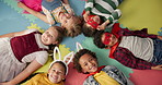 Happy kids, friends and costume in class above on floor for dress up or casual day at school together. Top view, portrait or young group with cosplay outfit, hero or fairy tale in halloween classroom