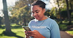 Volunteer, woman and cellphone for park clean up, community an social media for environmental education. NGO, online and outreach worker in nature, communication and internet coverage for event