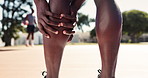 Legs, calf pain and athlete with injury outdoor at basketball court for exercise, fitness or training accident. Hands, sports person and massage muscle for fibromyalgia, arthritis or health problem