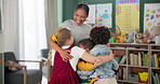 Happy woman, children and hug teacher at kindergarten for learning, education or development in class together. Smile, group and kids embrace educator in school for diversity, laugh or playing game