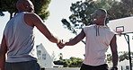 Outdoor, father and son with handshake after game or fitness, playing and memory in nature. Sports, exercise and happiness of black people with caring, proud or bonding with smile in basketball court