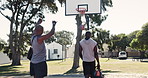 Outdoor, black men and score in basketball court while playing, fitness and challenge in nature. Sports, exercise and training outside with friends, movement and action with hobby or daily activity