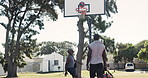 Sports, training and basketball players on court for outdoor training, workout or game together. Fitness, fun and African male athletes playing match for exercise or practice for teamwork on field.