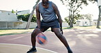 Man, outside and playing with basketball in court, Fitness and health for cardio sport in neighbourhood. Dribble, practice and motion for wellness, energy and player training for competition workout