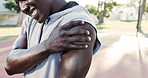 Hands, shoulder pain and black man with injury outdoor at basketball court for health exercise, fitness or training accident. Sport, arm and athlete with muscle problem, arthritis or fibromyalgia