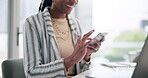 Business, online and black woman with smartphone at desk for social media, networking or scrolling web. Professional, corporate and happy consultant for texting, email or browsing internet in office